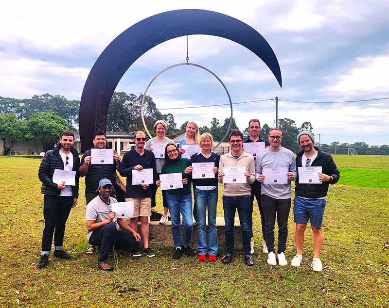 A group of researchers hold certificates