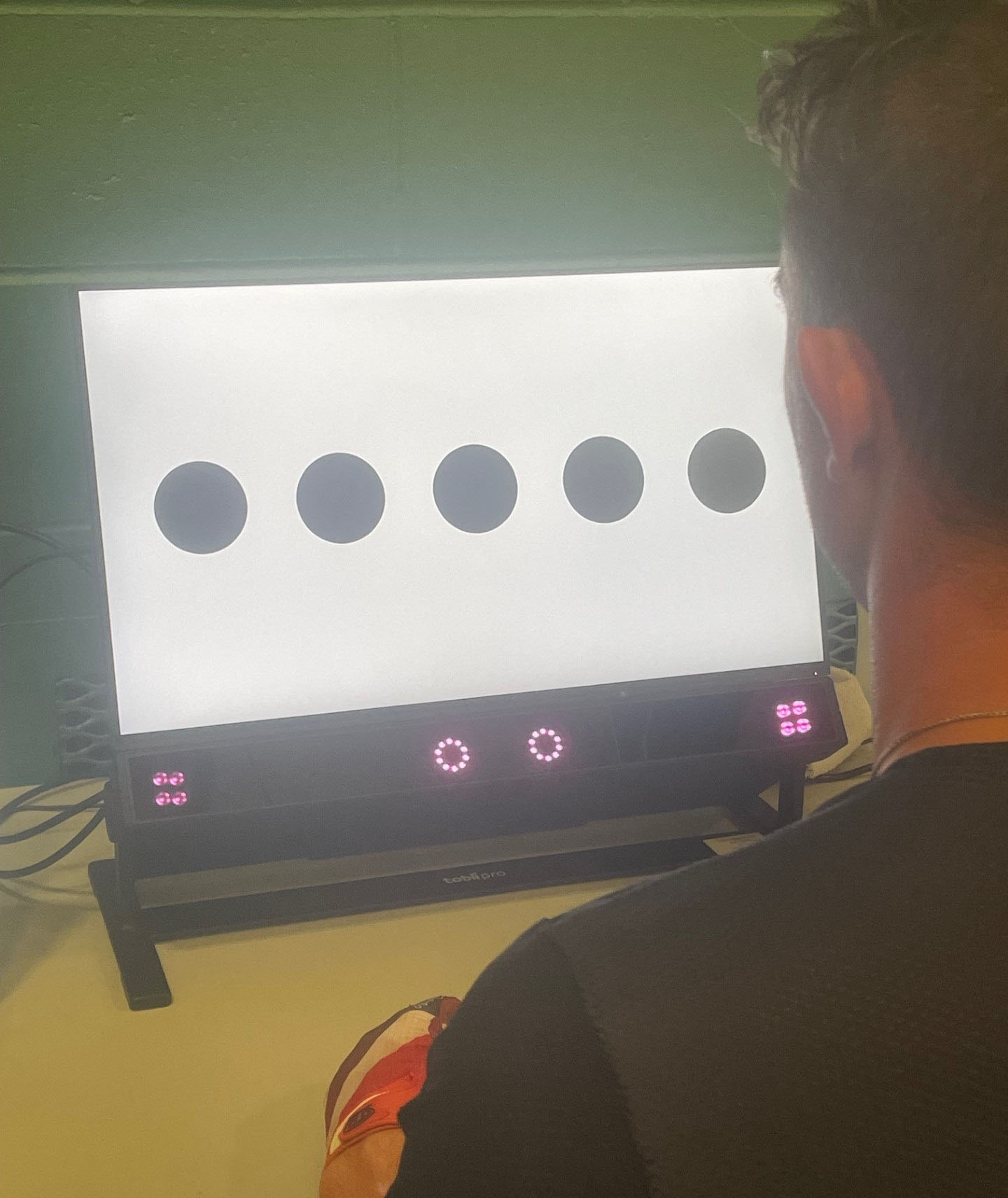 A man does a test involving dots on a screen.
