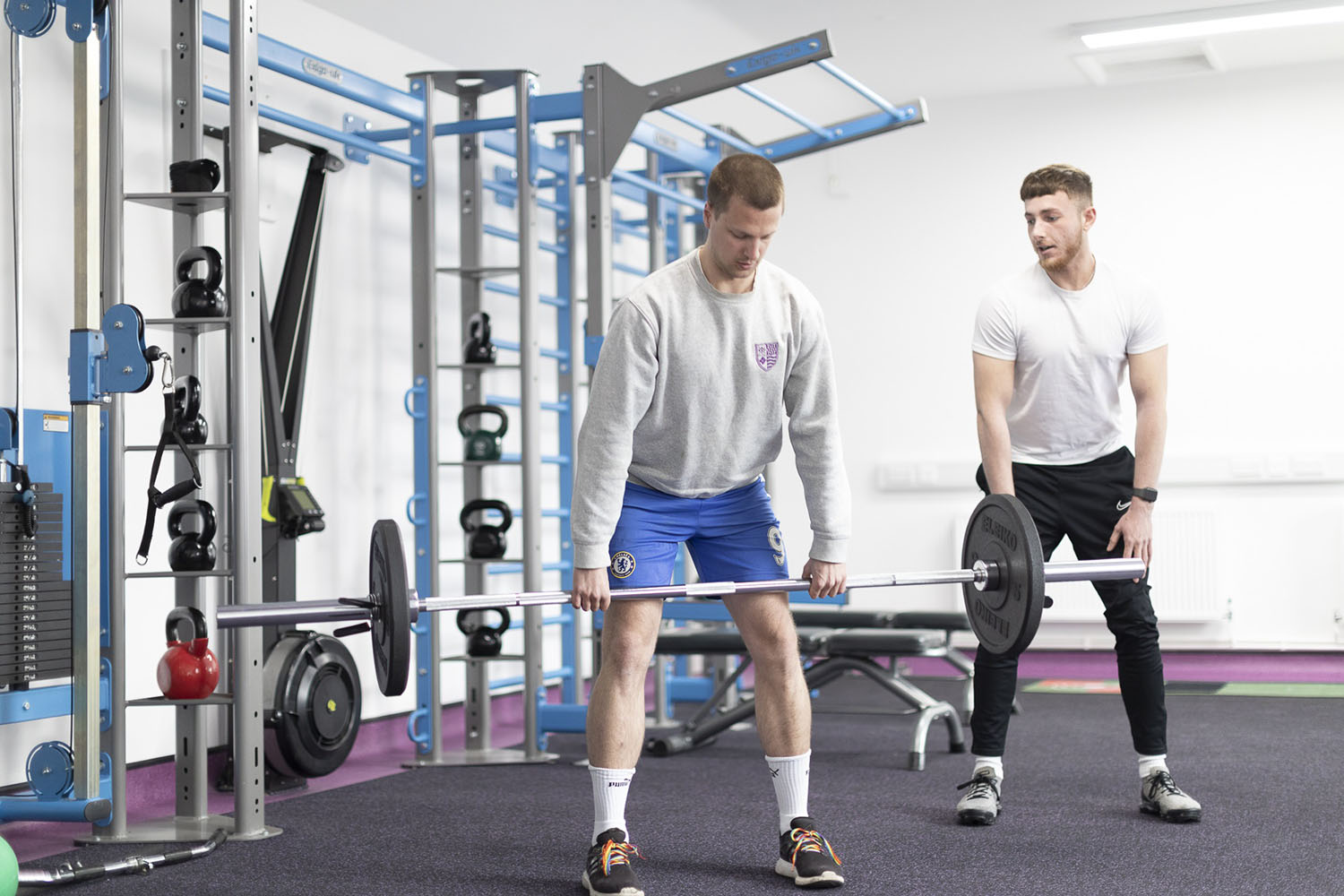 A student lifts weights.