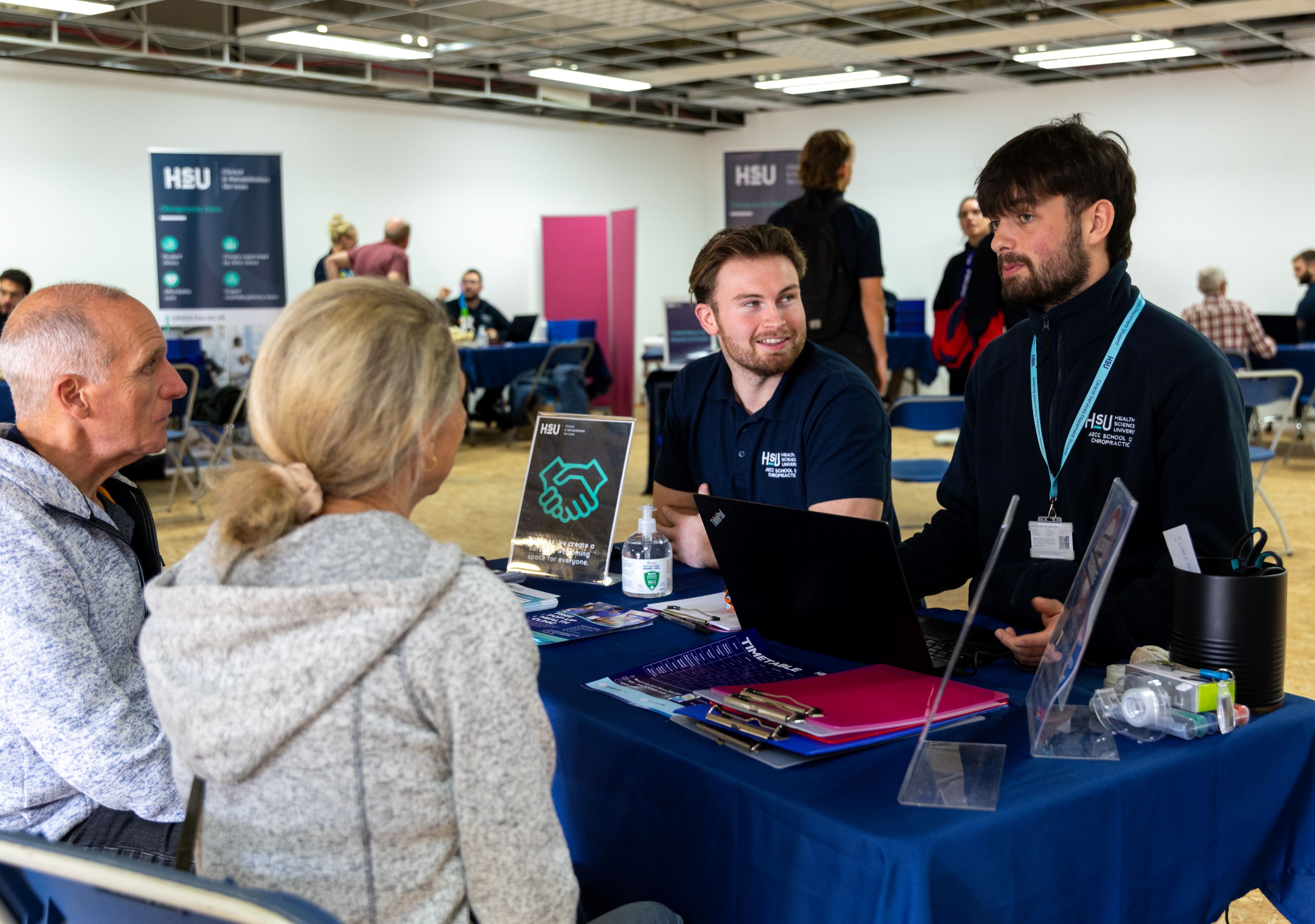 The welcome desk at the Health Sciences University health and support pop-up event