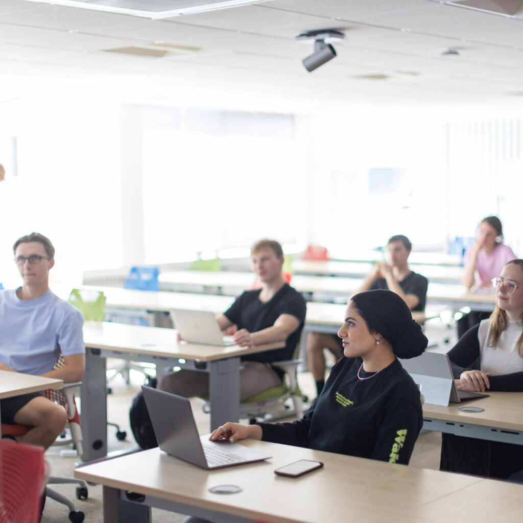 Students gathered in a classroom. 
