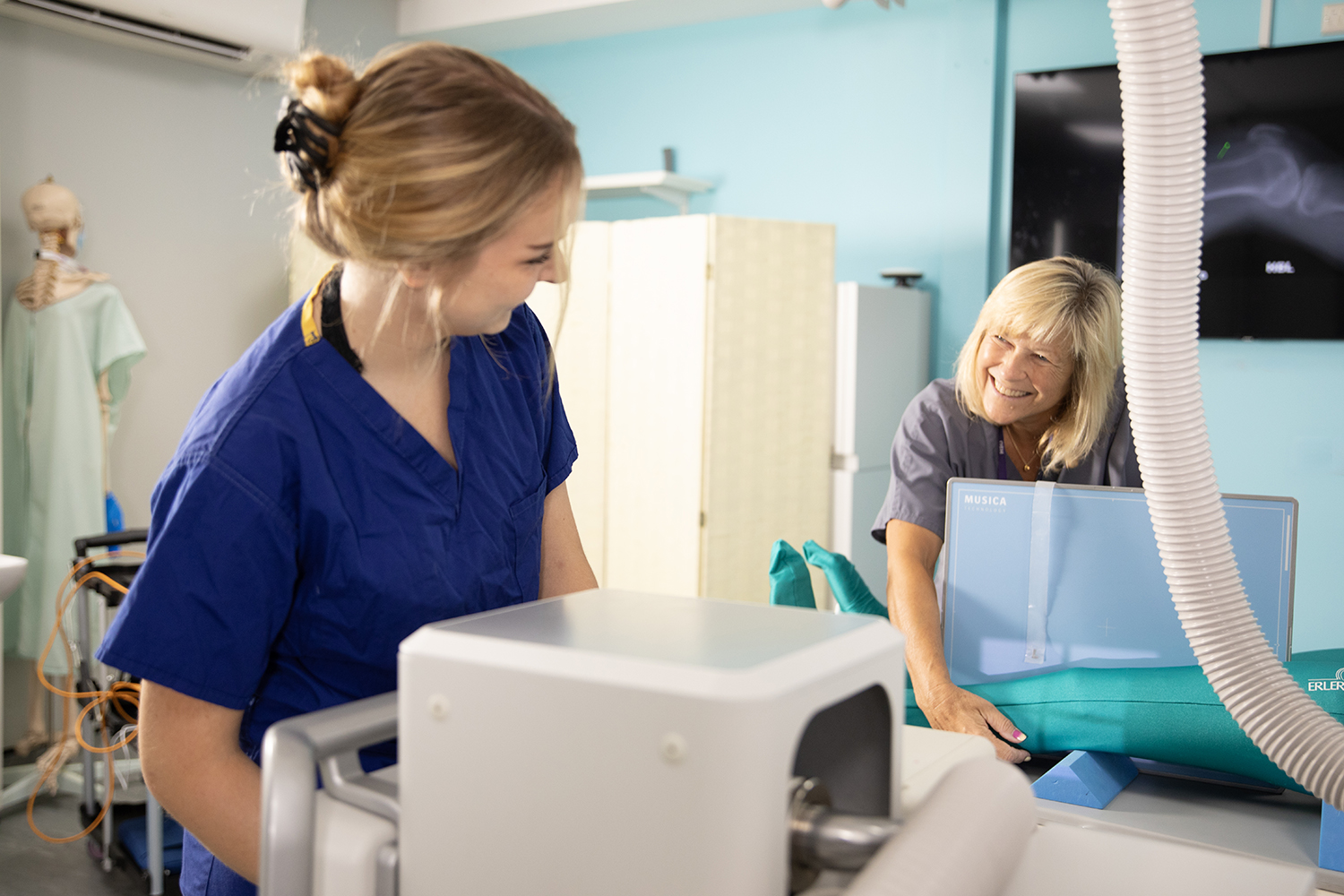 to people smiling using a radiography machine