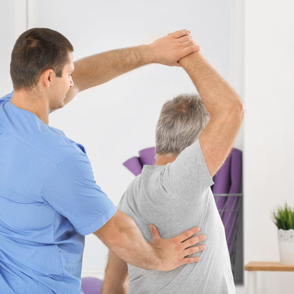 patient treating man in the clinic. 