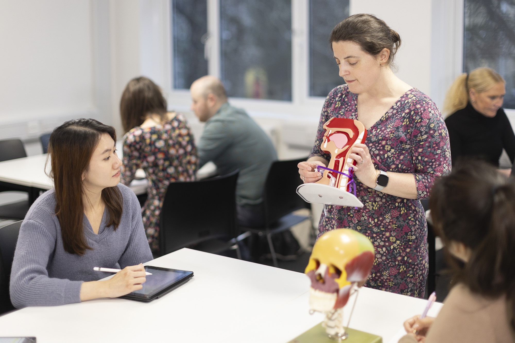 students together in a class being shown a demonstration