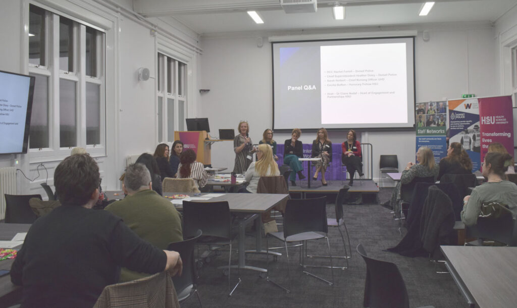 panel talking on stage at international woman's day 