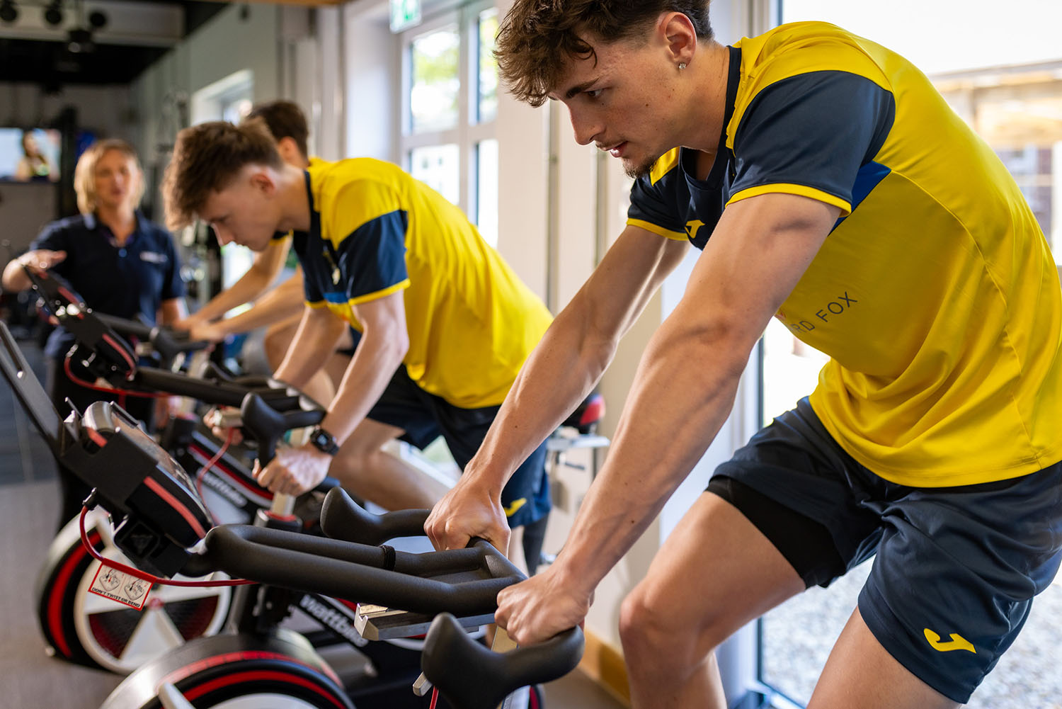 A person using an excercise bike.
