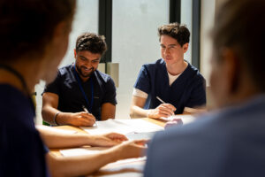 Students working together at a table.