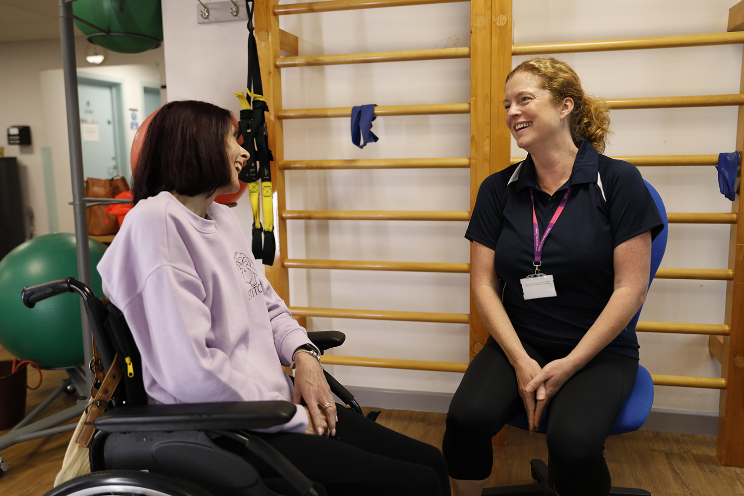A member of staff talks to a patient.