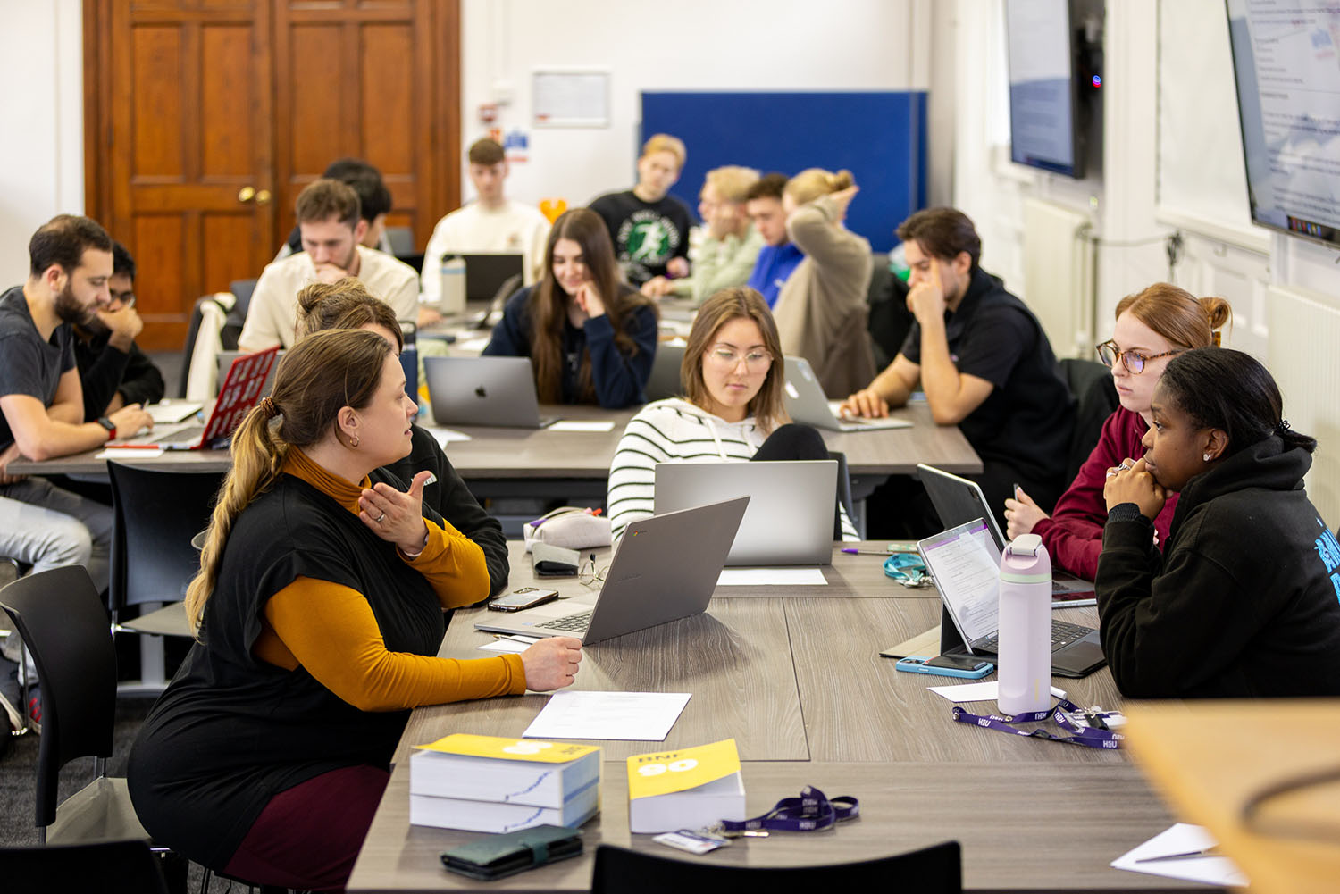 Staff working with students.