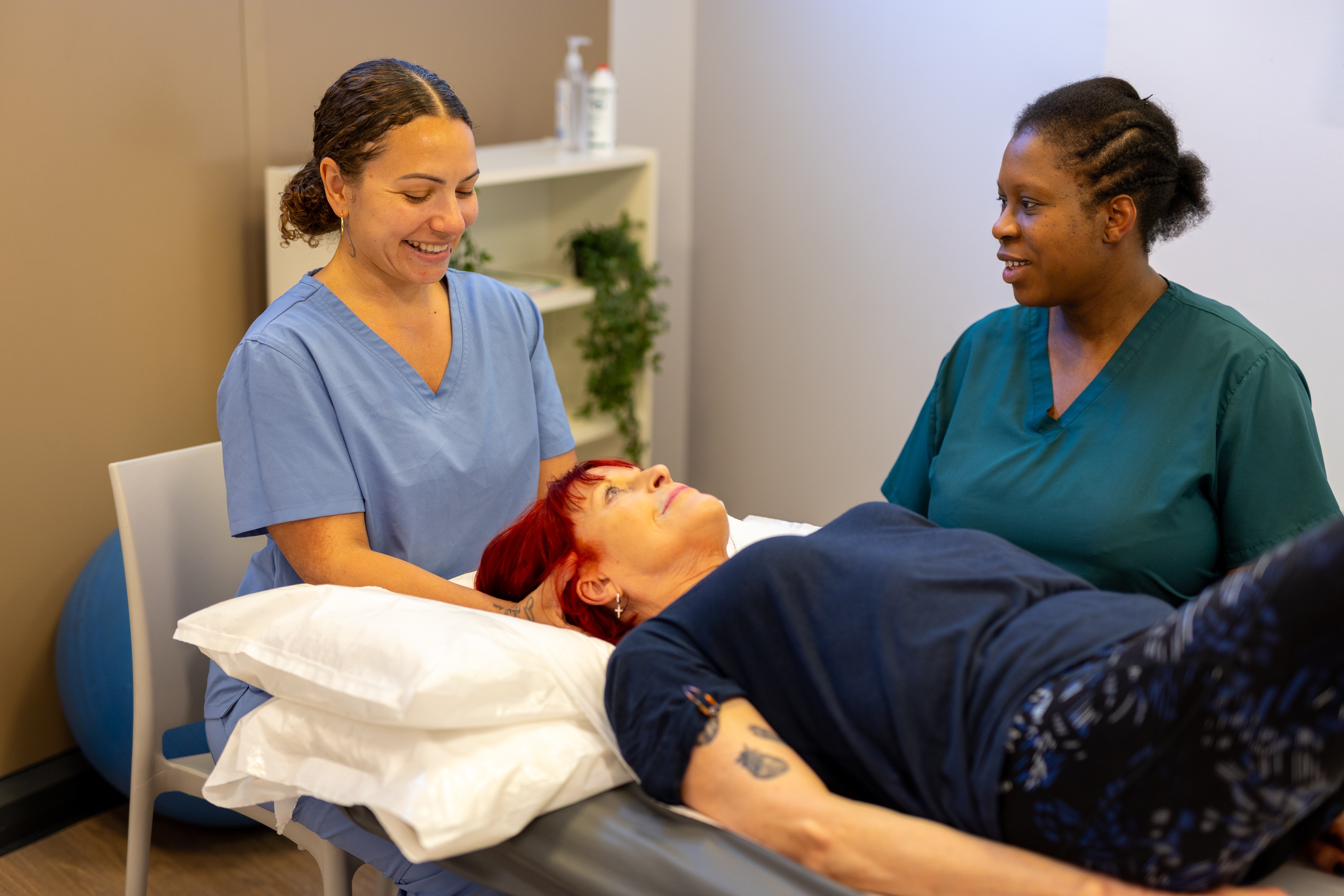 staff work with a patient.
